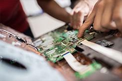 Students work on motherboard